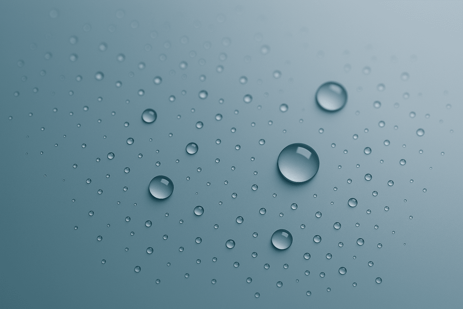 Close-up of water beading on an EnduroShield‑treated glass surface.