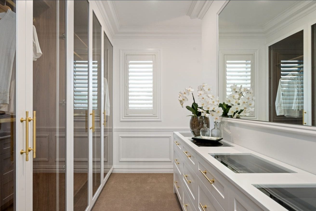 Walk‑in robe and vanity area featuring custom glass and glazing installation by First Class Glass in a North Shore home.